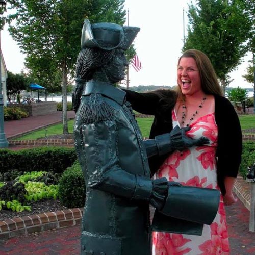 People having fun with statues